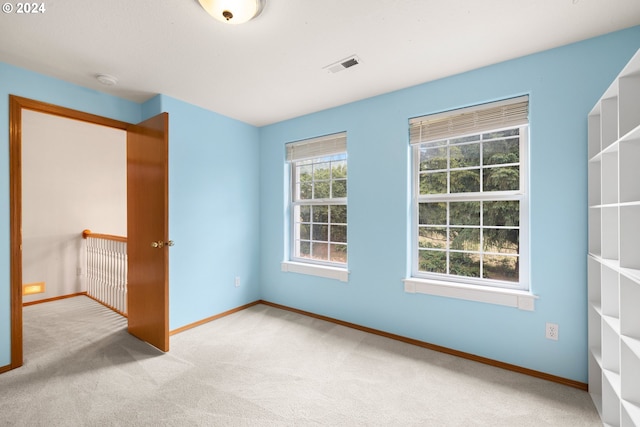 unfurnished bedroom with light carpet