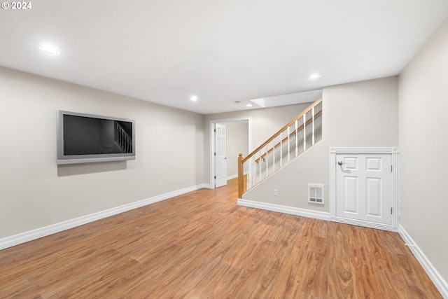 basement featuring light wood-type flooring