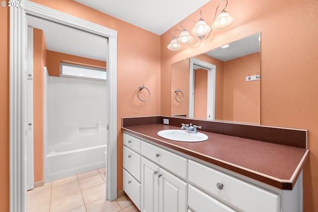 bathroom featuring vanity, shower / bathing tub combination, and tile patterned flooring