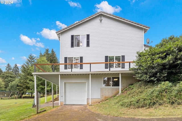 exterior space featuring a lawn and a garage