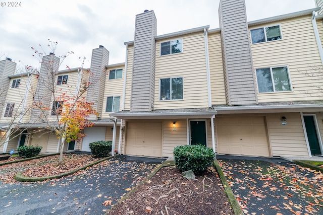 multi unit property featuring a garage