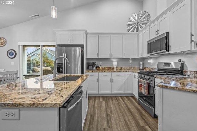 kitchen with dark wood-style floors, a sink, visible vents, high vaulted ceiling, and appliances with stainless steel finishes