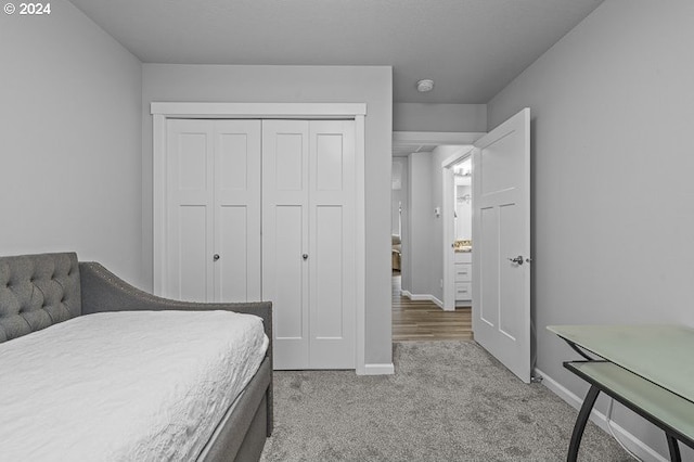 carpeted bedroom featuring a closet