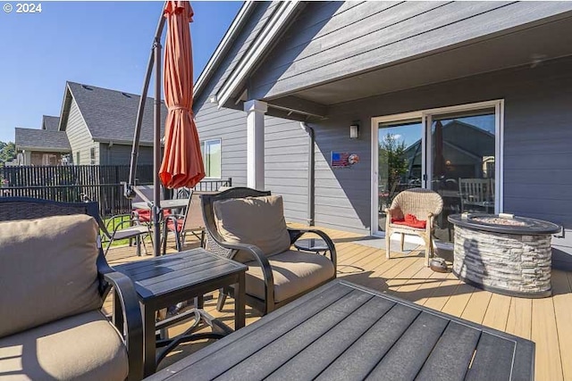 wooden terrace with fence and outdoor dining area