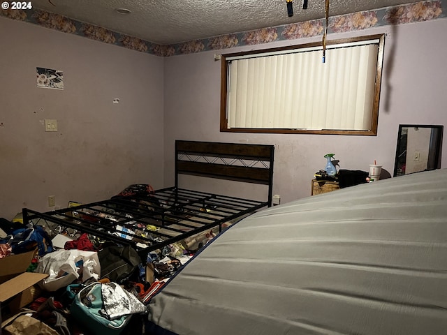 bedroom featuring a textured ceiling