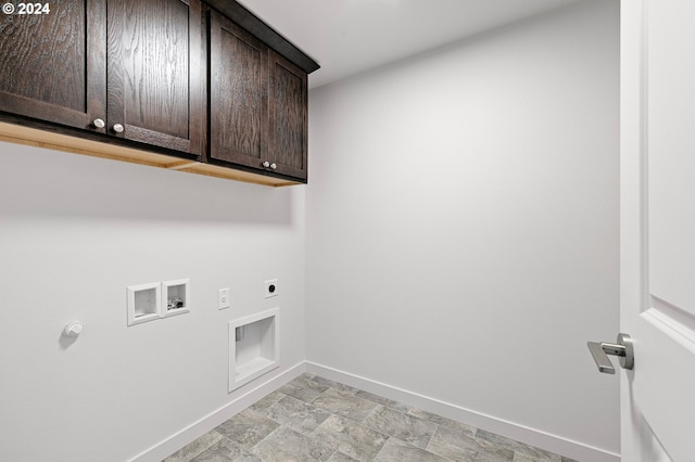 washroom featuring hookup for an electric dryer, cabinets, and washer hookup