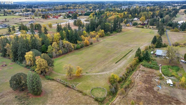 birds eye view of property with a rural view