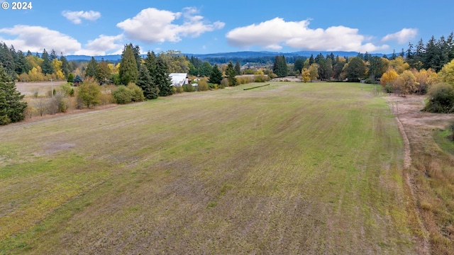 aerial view featuring a mountain view and a rural view