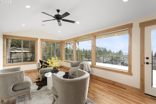 sunroom featuring ceiling fan and vaulted ceiling