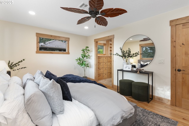 1017 Columbia Ridge Dr, Vancouver, WA 98664 - bedroom featuring wood finished floors, baseboards, recessed lighting, multiple windows, and ceiling fan