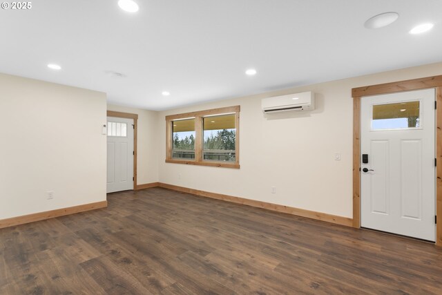 1017 Columbia Ridge Dr, Vancouver, WA 98664 - interior space with a wall unit AC, baseboards, dark wood-style floors, and recessed lighting