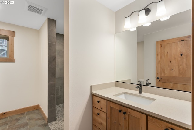 bathroom with vanity and walk in shower