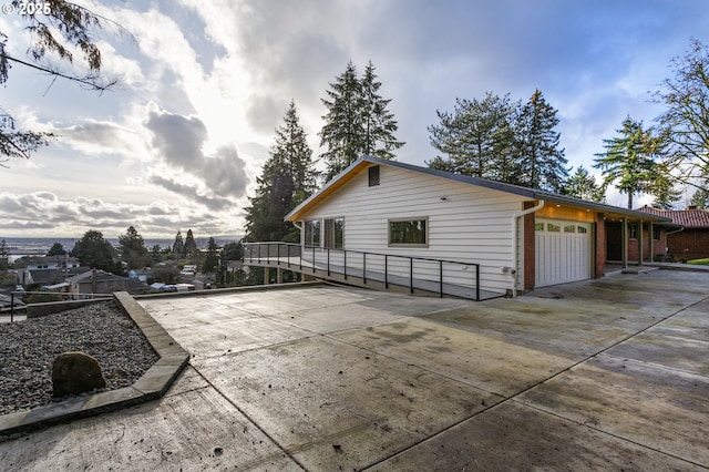 view of side of property featuring a garage