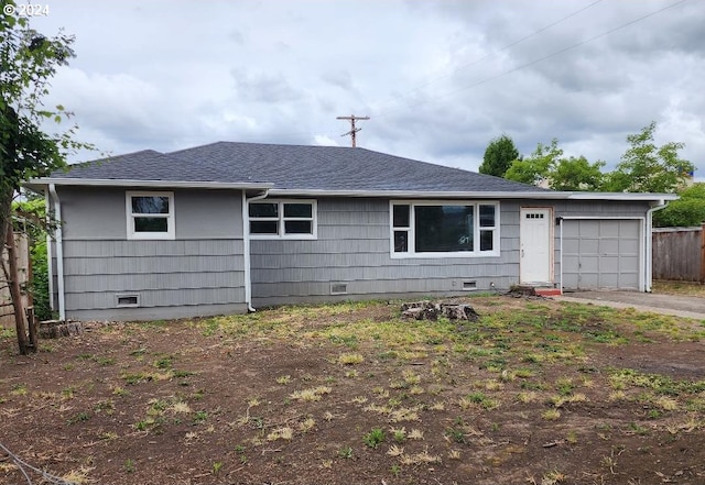 ranch-style house featuring a garage