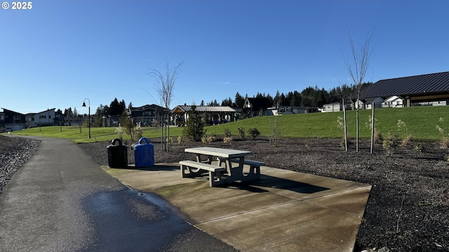 view of home's community with a lawn