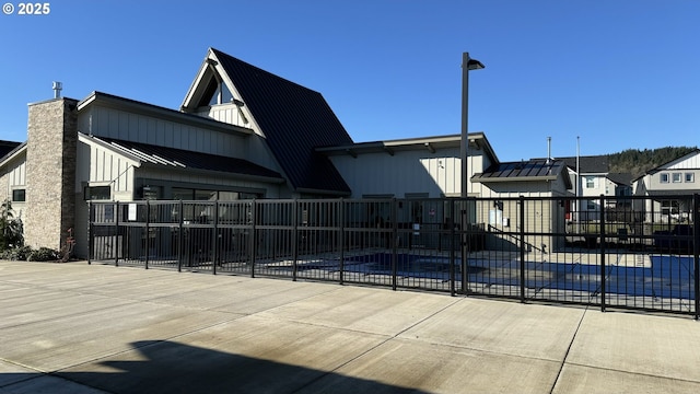 exterior space with a community pool and a patio area