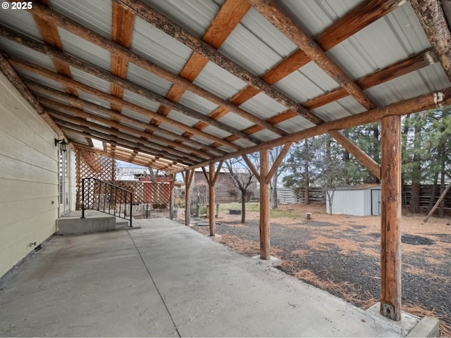 view of patio / terrace with a storage shed