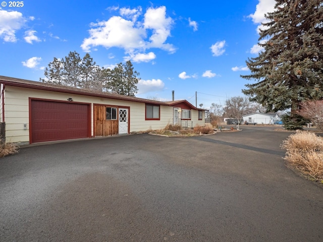 ranch-style house featuring a garage