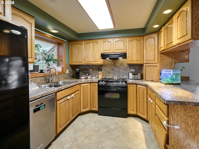 kitchen featuring sink, decorative backsplash, and black appliances