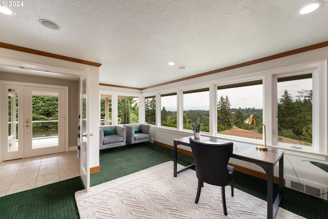 sunroom featuring visible vents and french doors