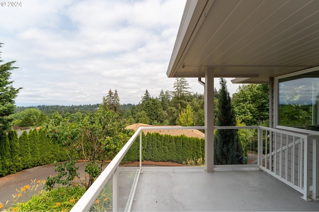 exterior space with a wooded view