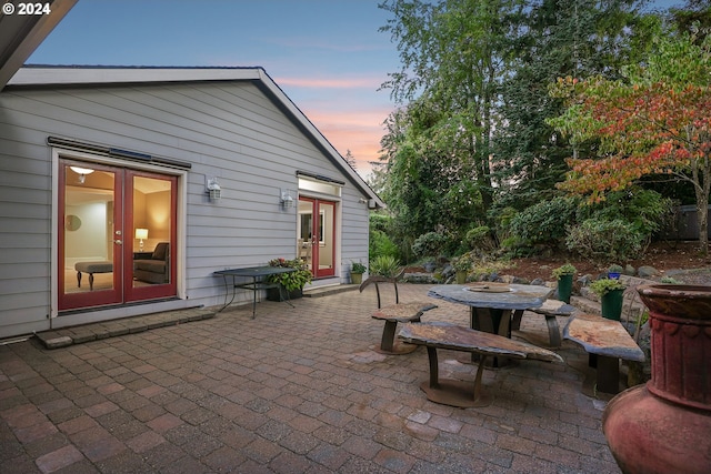 view of patio / terrace with french doors and a fire pit