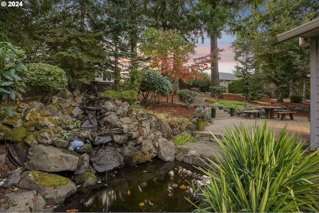 view of property's community with a patio area