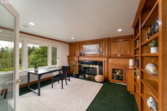 home office with recessed lighting, a textured ceiling, ornamental molding, and a tile fireplace