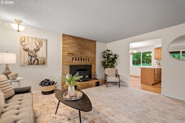 carpeted living room with a textured ceiling, a chandelier, and a brick fireplace