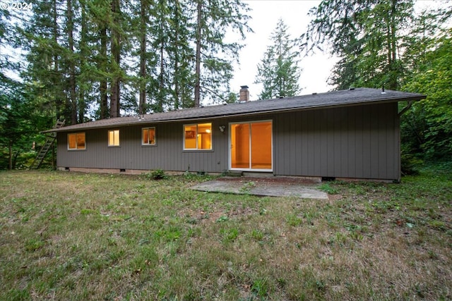 ranch-style house featuring a patio and a front yard