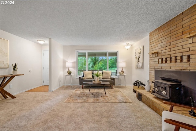 carpeted living room with a brick fireplace and a textured ceiling