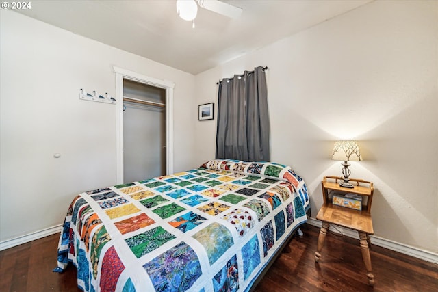 bedroom featuring a closet, dark wood-type flooring, and ceiling fan