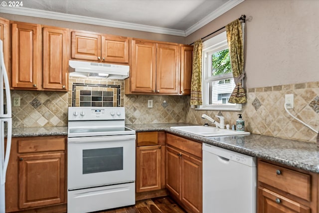 kitchen featuring white appliances, sink, dark hardwood / wood-style floors, ornamental molding, and tasteful backsplash