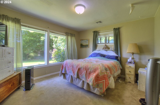 bedroom featuring light carpet