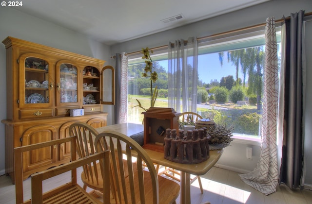 dining area with light tile patterned floors