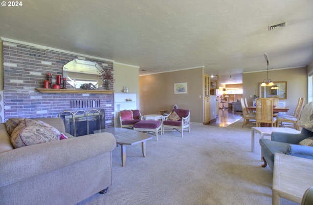 living room with ornamental molding, a brick fireplace, an inviting chandelier, and carpet flooring