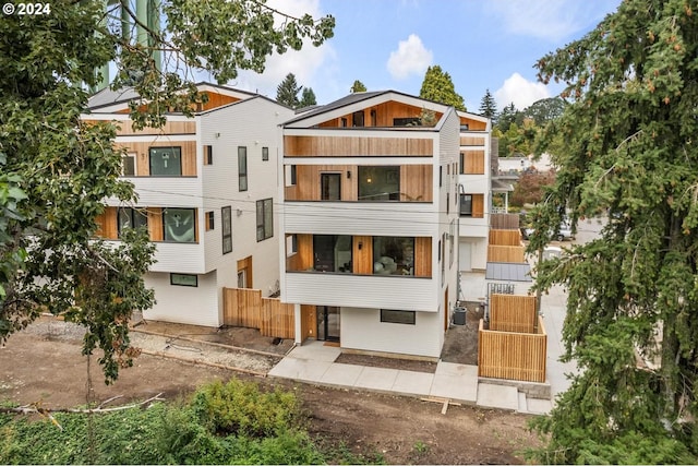 back of property with a balcony