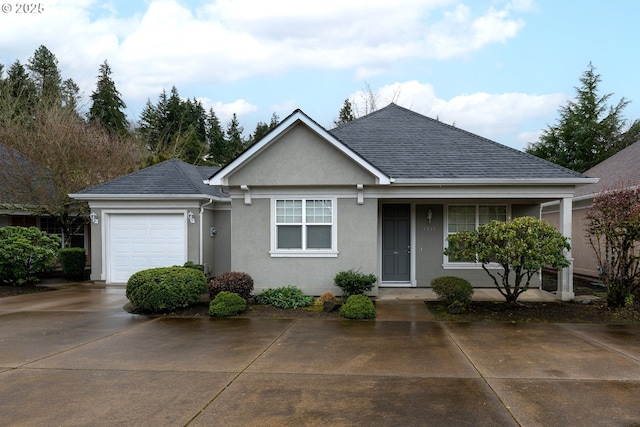 single story home featuring a garage, concrete driveway, roof with shingles, and stucco siding