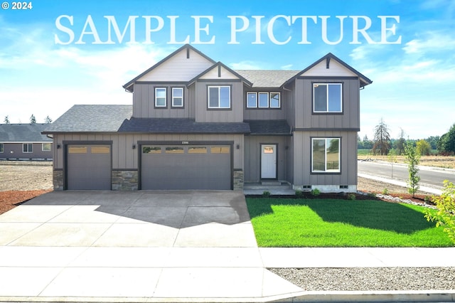 view of front facade featuring a garage and a front lawn