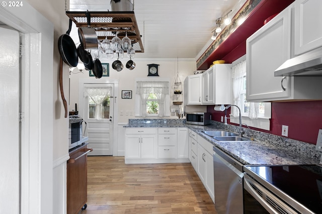 kitchen featuring white cabinetry, appliances with stainless steel finishes, sink, and light hardwood / wood-style flooring