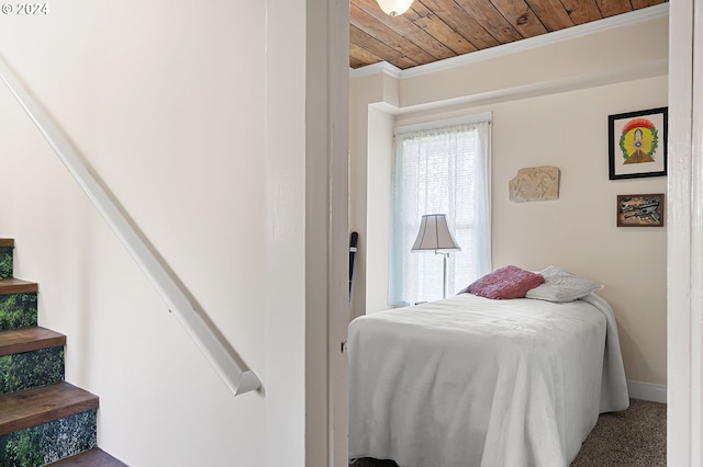 bedroom featuring crown molding and wood ceiling