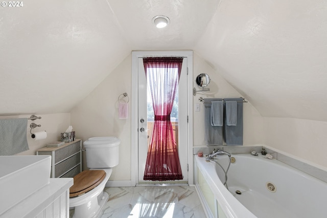 bathroom with lofted ceiling, vanity, a washtub, toilet, and a textured ceiling