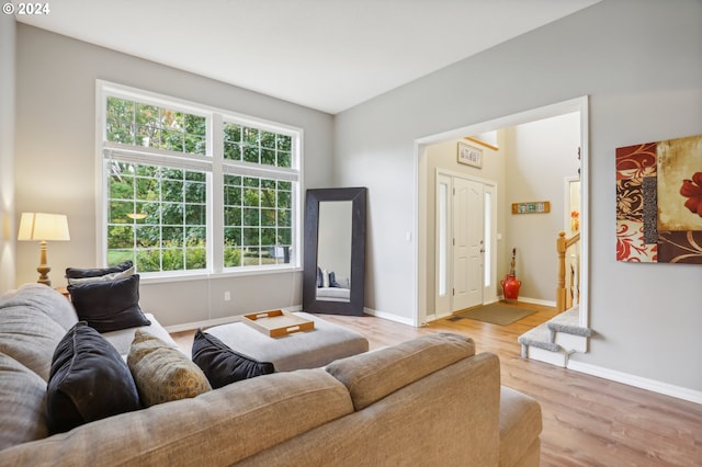 living room featuring plenty of natural light and light hardwood / wood-style floors