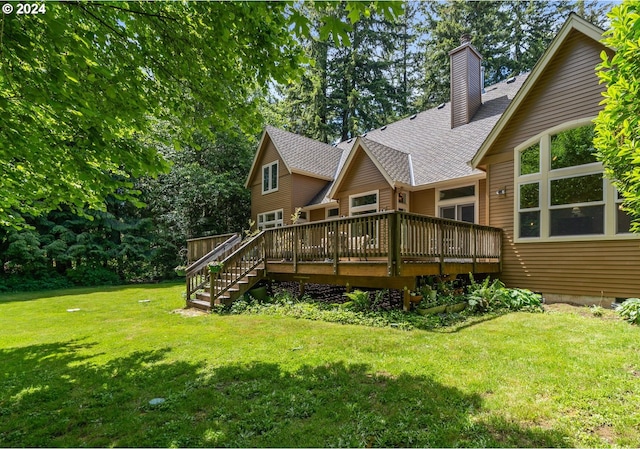 back of property featuring a yard and a deck