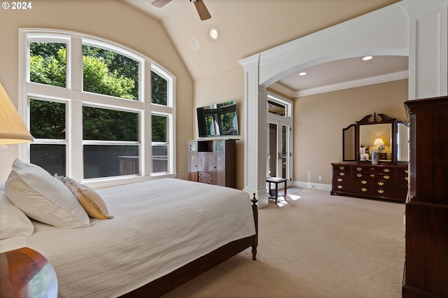 bedroom with ceiling fan, light colored carpet, lofted ceiling, and ornamental molding