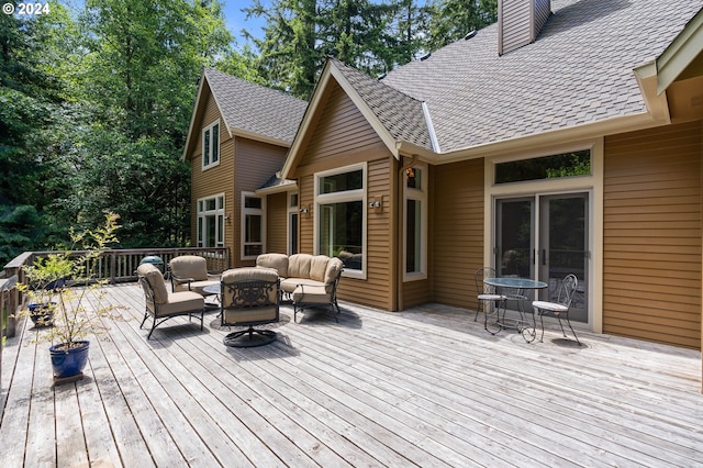 wooden deck featuring outdoor lounge area