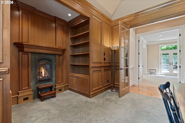12320 NW Sargent Ln, Portland, OR 97231 - detailed view of french doors, carpet floors, a large fireplace, crown molding, and recessed lighting