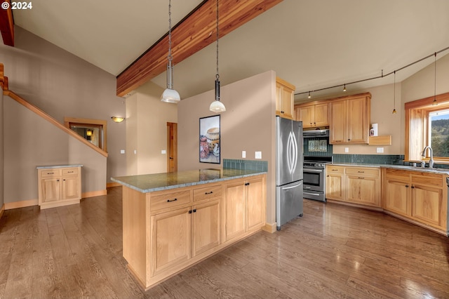 kitchen with stone countertops, light wood-type flooring, light brown cabinetry, decorative light fixtures, and stainless steel appliances