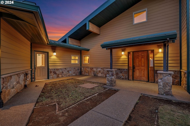 view of exterior entry at dusk