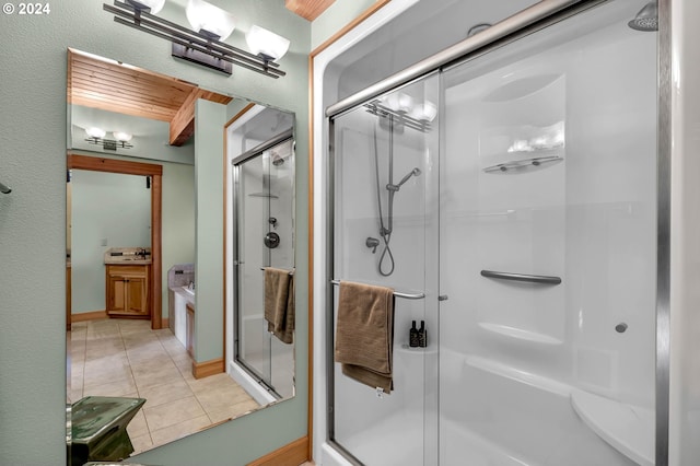 bathroom featuring sink, tile patterned flooring, and shower with separate bathtub